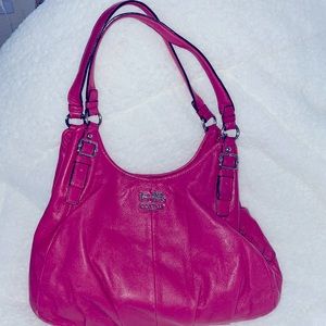 pink coach bag, silver hardware, and three separate compartments.